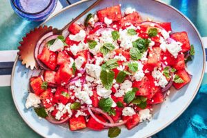 Watermelon feta salad with fresh mint and balsamic drizzle served as a refreshing spring and summer side dish.